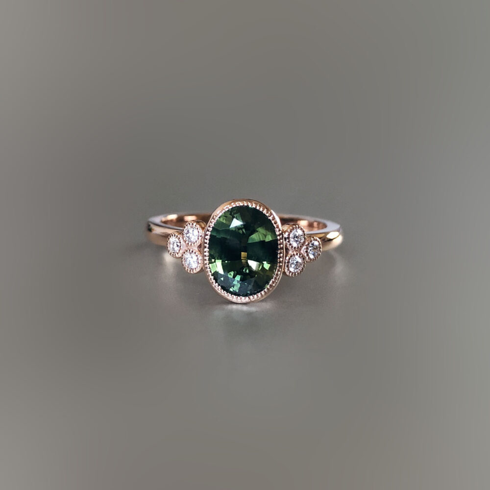 Rose gold and Australian green sapphire ring with diamond side stones