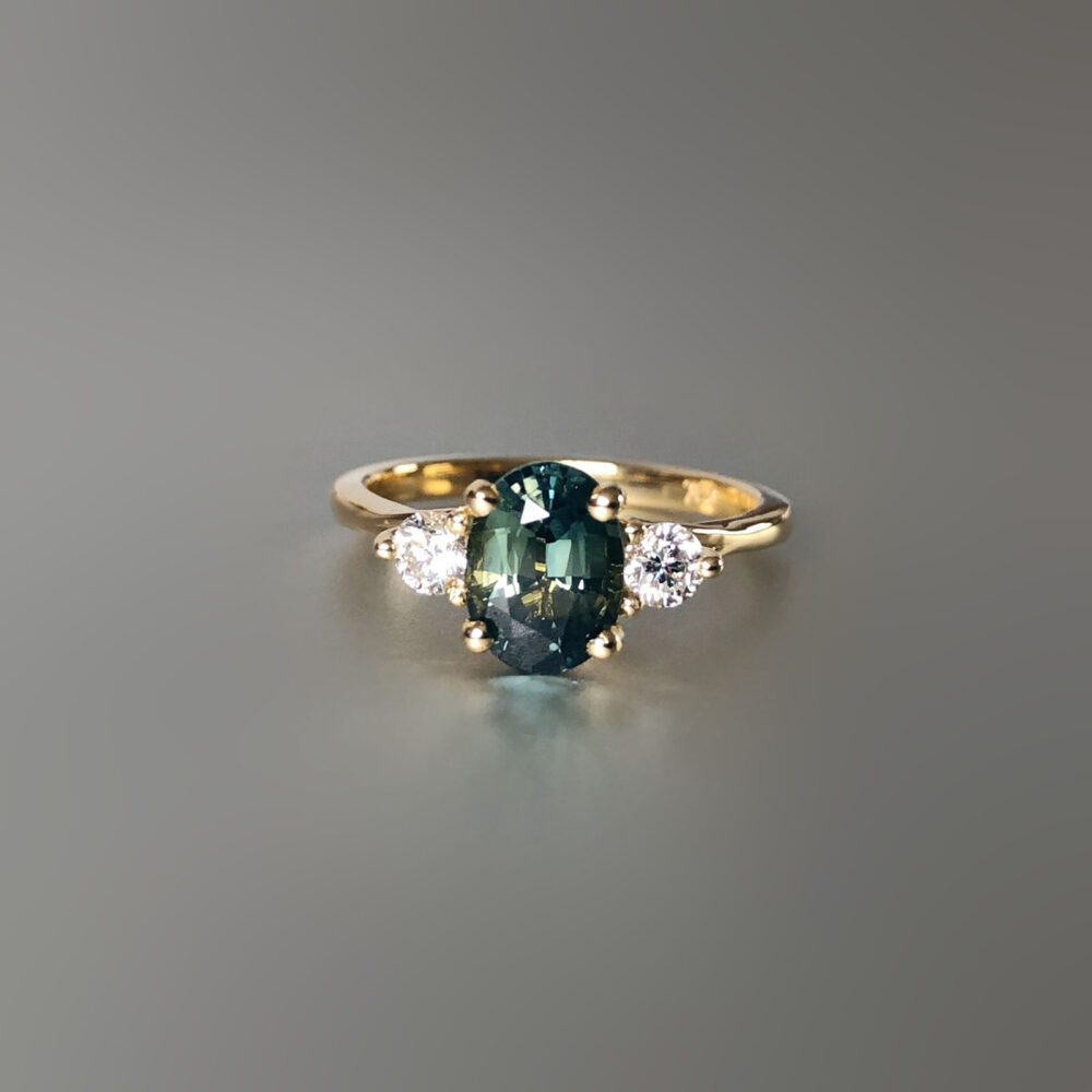 Australian sapphire ring with diamond side stones in yellow gold