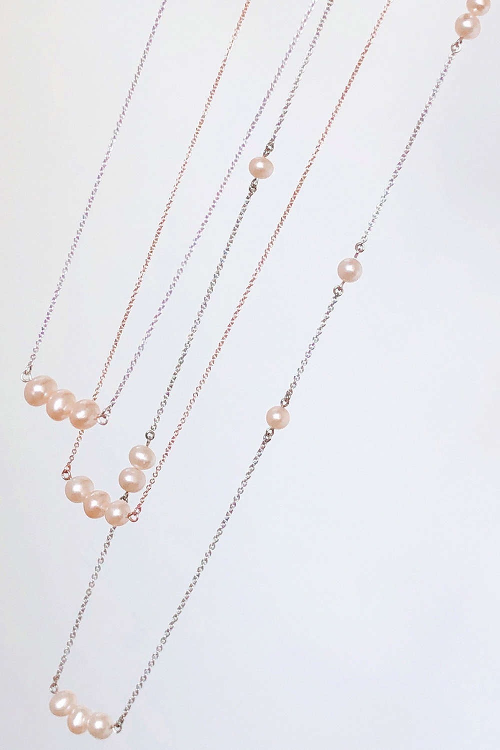 White gold and rose gold pearl necklaces