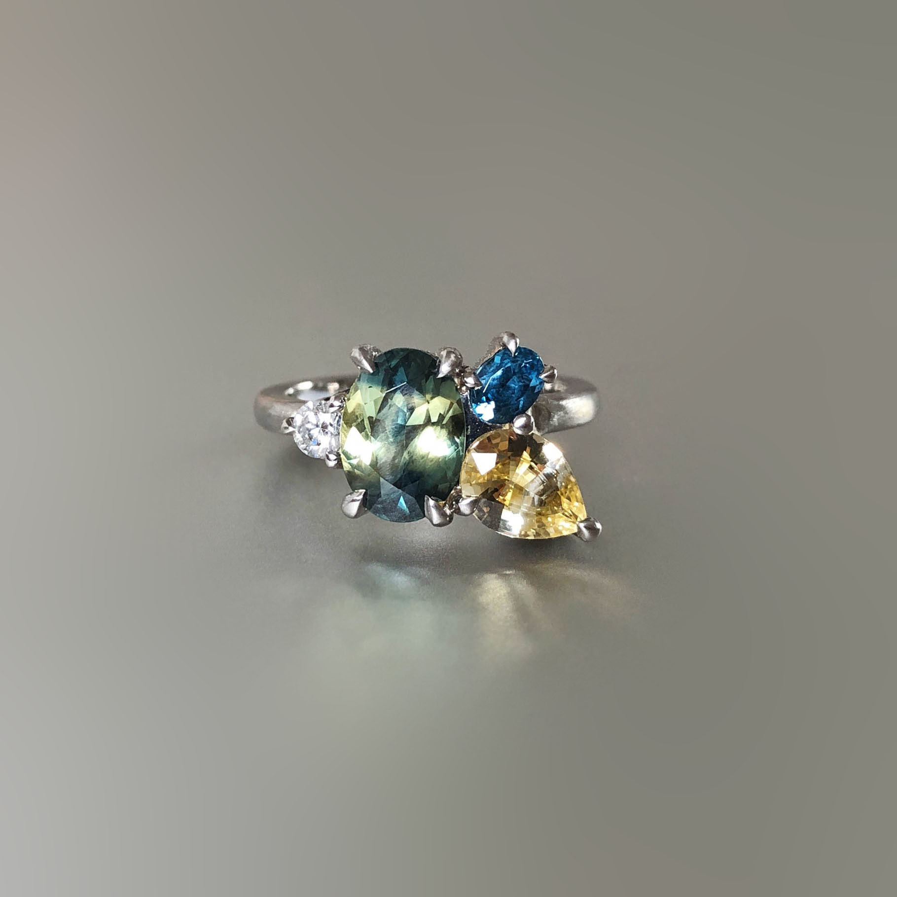 Platinum, sapphire, diamond and London blue topaz cluster ring