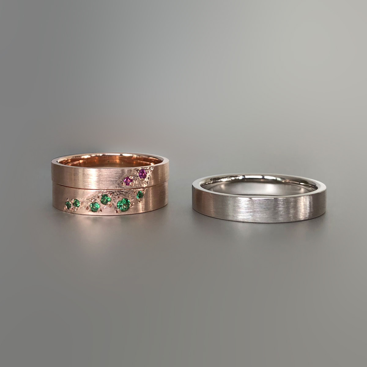 Rose gold and white gold rings with tsavorite garnets and pink sapphires