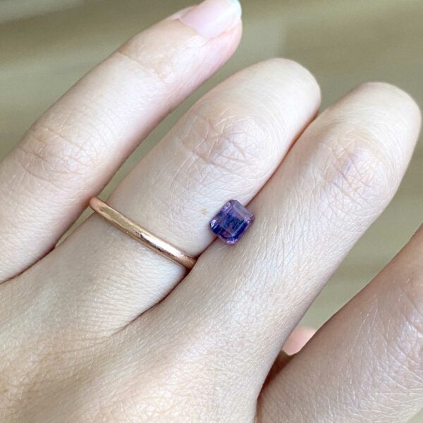 Pink and blue mixed colour sapphire on hand