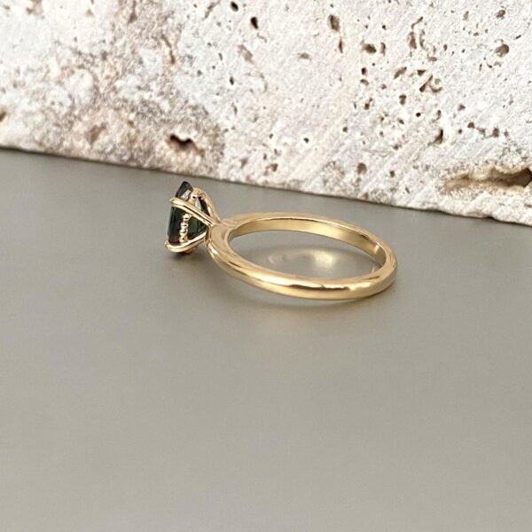 Drop shaped solitaire ring in yellow gold side view