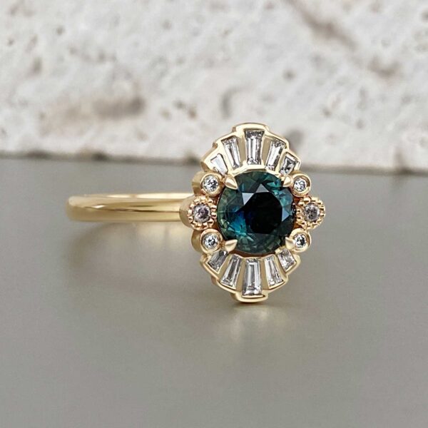 Halo ring with round sapphire, white diamonds and champagne diamonds