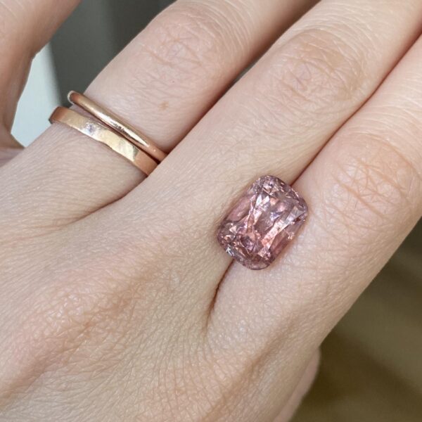 Australian Harts Range pinkish zircon gem displayed on hand
